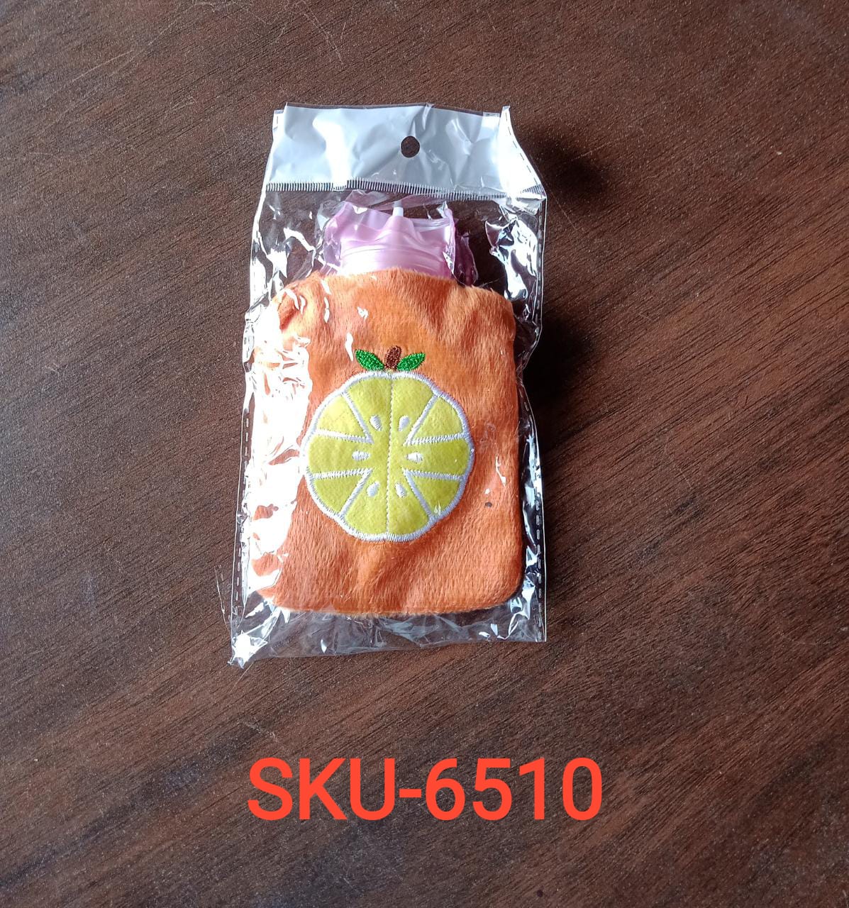 Orange hot water bag with cover for relief and warmth Orange hot water bag with cover for relief and warmth